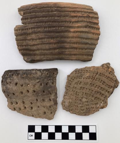 three ceramic fragments two are rims, punctuated holes make designed