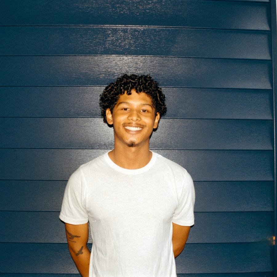 Benito beside Blue wall