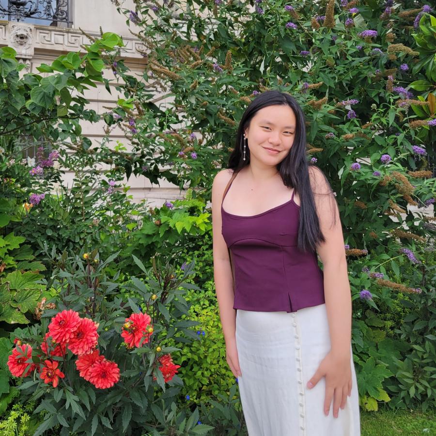 Mianna beside flowers